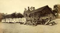 Children and teachers outside Ockham village school, late 19th century 