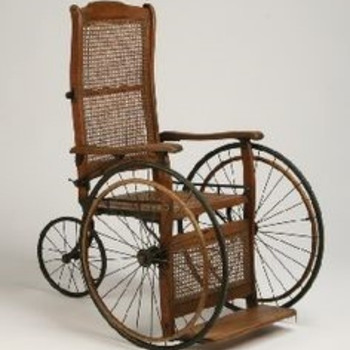 A photograph of a 19th century wheelchair