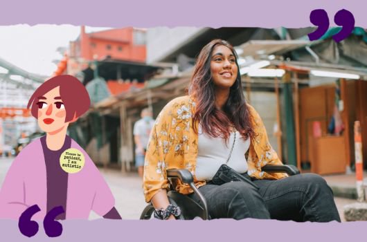 A young woman in a wheelchair going down a road.