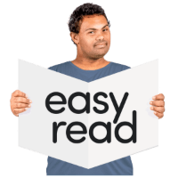 Man with easy read sign