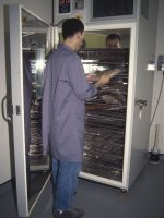 Operative using blast freezer at Surrey History Centre