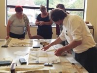 Woking Mind looking at documents at Surrey History Centre