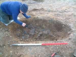 Excavating a large feature during excavations at St. Ann's Heath Primary School