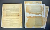 AFTER: These documents were previously repaired with contact adhesive tape. The conservation team removed the discoloured tape and rebuilt the missing areas with specially selected archival papers