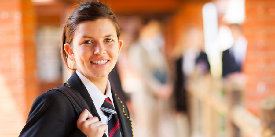 Schoolgirl smiling at camera