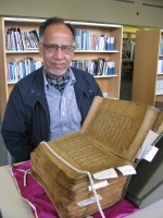 Cllr Raja at Surrey History Centre with his family Qur'an, 2016 