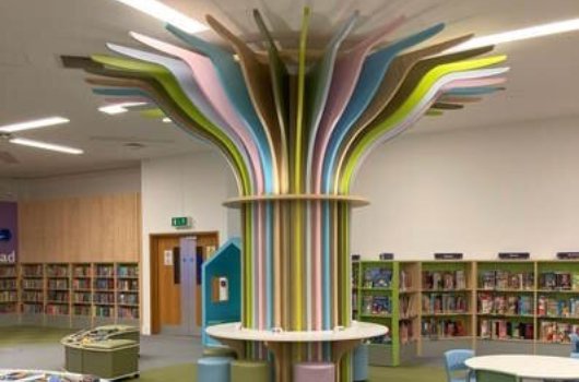 Book shelves and seating areas at Woking Library