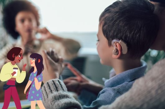 A woman talking to a young person who is wearing a hearing aid.