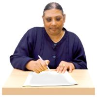 A lady filling out a form
